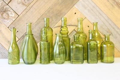 green coloured vintage styled bottles